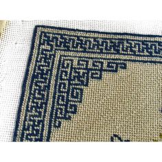 a blue and white rug on top of a table