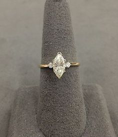 a diamond ring sitting on top of a rock