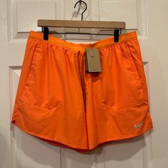 Questions? Leave A Comment Below! Nike Gym Athletic Shorts With Pockets, Nike Athletic Shorts With Pockets For Gym, Nike Athletic Shorts With Pockets For Workout, Nike Short Swim Trunks For Sports, Orange Athletic Shorts With Elastic Waistband For Sports, Orange Athleisure Bottoms For Jogging, Sporty Nike Swim Trunks With Pockets, Sporty Orange Swim Trunks For Sports, Orange Athletic Shorts For Sports