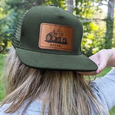 "Drive", mesh adjustable snapback hat Does your kid love tractors? In pairing original artwork with a leather patch and high quality craftsmanship, the hat is perfect for all your days on the farm! **SIZING INFO** Fits 18"-21" head circumference and have a mesh backing. The adjustable straps fit head circumference of 18-21 inches and fit best on ages three and up. Measure your child's head circumference to be sure! Every child is different. WHAT MAKES US DIFFERENT - We are a family company, woma Hat For Kids, Farm Kids, Western North Carolina, Mountain Hiking, Farm Tractor, On The Farm, Just Run, Kids Hats, Head Circumference