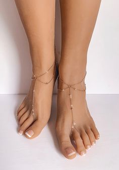 Amanda Rose Gold Barefoot Sandals are a stunning pair of barefoot sandals which features a minimalist design and barely there feel. Handcrafted using 1.5mm cable chain with tiny metal balls which are ingrained into the chain. Lobster clasp closure on the back of the sandals accommodates all foot sizes and does not restrict the movement of your feet. Wear them as a pair or individually. Perfect gift for a true minimalist. Sold as a pair. Gift Wrapped. Ships in 2 business days. All rights reserved Rose Gold Anklet, Beach Wedding Shoes, Beach Jewelry Boho, Jewelry Rose Gold, Anklets Boho, Wedding Bridesmaid Jewelry, Amanda Rose, Boho Sandals, Sandals Beach