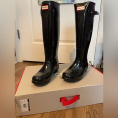 Comfort And Quality Combine In A Glossy, Water-Tight Rubber Boot Finished With A Traction-Gripping Sole. A Subtle Tonal Design Circles The Top, While An Adjustable Buckle At The Side Adds Interest. 1" Heel (Size 9). 16" Boot Shaft; 15 1/2" - 16 1/2" Calf Circumference; Adjusts To Fit Wide Calf. In Hot Or Humid Weather, Natural Latex Rubber Releases A Protective Wax Film; Simply Wipe It Off With A Damp Cloth. A Pristine Finish And Shine Is Easily Restored With Regular Use Of Hunter Boot Buffer Or Fitted Waterproof Black Boots, Slip-resistant Black Rain Boots, Outdoor Slip-resistant Rain Boots, Ankle-high Rain Boots For Outdoor, Outdoor Ankle-high Rain Boots, Hunter Boot, Black Waterproof Ankle-high Rain Boots, Hunter Shoes, Humid Weather