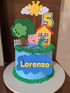 a peppa pig birthday cake with the number five on it's top tier