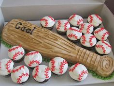 cupcakes and a baseball bat in a box with the word gad on it