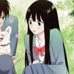 two anime characters sitting next to each other with a cat on their lap and one holding a dog