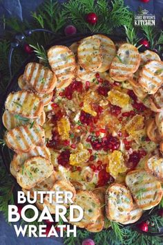 the cover of butter board wreath is surrounded by small waffles and cranberries