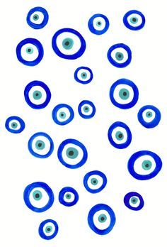 blue and white circles are arranged in the shape of an evil eye on a white background