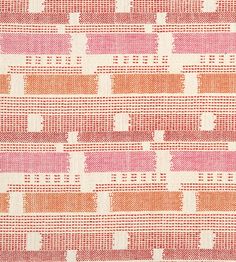 an orange and pink pattern on fabric