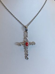 This cross displays a beautiful piece of Red Coral in the middle of a wavy cross. The cross is about 2.5" and 1.5" in width. The chain is 18"Please let us know if you have any questions! Red Cross Pendant Necklace Gift, Red Cross Pendant Necklace For Gift, Red Crucifix Cross Necklace Gift, Red Crucifix Cross Necklace For Gift, Red Spiritual Cross Pendant Jewelry, Spiritual Red Cross Pendant Necklace, Glendale Az, Dragon Ring, Vintage Diamond Rings