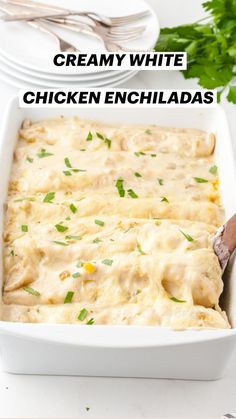 creamy white chicken enchiladas in a casserole dish