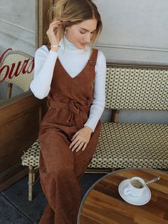 The Sleeveless Belted Jumpsuit is a fun and stylish way to add some flare to your wardrobe. This jumpsuit features a lined top, an unlined bottom, and a waist belt for an adjustable fit. The corduroy fabric is soft yet durable and comes in a variety of colors for you to choose from. It has four buttons along the straps for added detail as well as two pockets at the sides for extra convenience. With its comfortable fit and trendy look, this overall jumpsuit is perfect for any occasion! Specifications: Pattern Type: Plain Length: Long Fit Type: Regular Fit Neckline: Straps Sleeve Length: Sleeveless Waist Line: High Waist Composition: 100% Polyester Care Instructions: Machine wash or professional dry clean Belt: Yes Size Chart: Size US Bust Hip Size Inseam Length Thigh Waist Size XS 2 96 102 Jumpsuit With Sweater, Jumpsuit Winter Outfit, Overalls Outfit Fall, Jumpsuit Winter, Nashville Outfit, Corduroy Overall, Comfy Jumpsuits, Overalls Outfit, Belted Jumpsuit