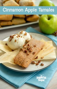 two plates with dessert items on them next to some apples and cinnamon roll sticks in the background