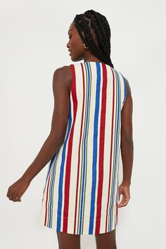 The Americana Stripe Kira Dress is the epitome of summer fun all wrapped into one style. This adorable mini features a V-neckline, shift silhouette, and retro-chic striped pattern that instantly transports us to boardwalks and ice cream dates. Pair with sandals and a crossbody for barbecues, patio happy hours, and fireworks! V-neckline Sleeveless Side pockets Shift silhouette Mini length Lined Material: 100% Cotton Care: Hand wash cold, do not bleach, hang to dry, low iron Striped Mini Dress For Vacation, Summer Mini Dress With Vertical Stripes, Casual Summer Mini Dress With Vertical Stripes, Chic Striped V-neck Mini Dress, Summer Striped V-neck Dress, Striped V-neck Summer Dress, Beach Dresses With Vertical Stripes And V-neck, Vertical Stripes V-neck Vacation Dresses, Summer Dresses With Vertical Stripes For Vacation