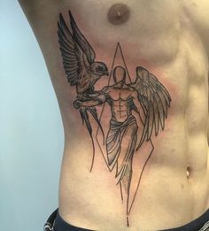 a man with a tattoo on his stomach holding an eagle in front of the chest