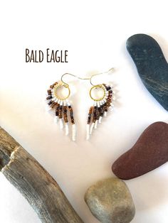 Handmade, lightweight, durable, beaded dangle earrings. For bird, raptor, and falconer enthusiasts! Bird type: Bald Eagle Size: Extra small hoop size, and 2 inches total length from hook to end of the longest beaded strand. Hoop size: Extra small: 12mm (0.5 inches) Materials: Gold hooks, with Gold K hoops. Made with glass beads, 6lb mirco-infused Fireline thread, glue, and rubber earring backing. Care instructions included. Processing: Please allow 1-3 days for processing. Shipping: Ships USPS Ground. Delivery time depends on your location. Returns: You may return your item as long as you pay for return shipping. A full refund will be given if the jewelry is returned in the same condition when purchased. 40% of every raptor related sale is donated to the Rocky Mountain Raptor Program, a pa Bird Types, Gold Hooks, Extra Petite, Glass Bead Earrings, Beaded Dangle Earrings, Bead Earrings, Beaded Dangles, Glass Bead, Bald Eagle