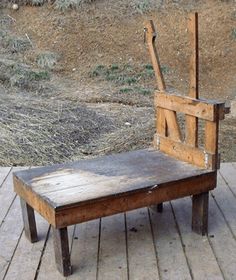 an old wooden chair sitting on top of a wooden floor