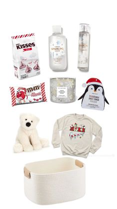 the contents of a baby's christmas gift set including a teddy bear, diaper and other items