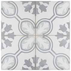 a white and gray tile with leaves on it