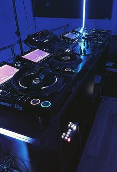 dj equipment sitting on top of a table in a room