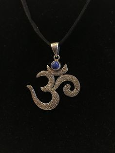 "Sterling Silver \"OM\" Pendent Om, also written as 'Aum', is the most sacred syllable, symbol, or mantra in Hinduism, that signifies the essence of the ultimate reality, consciousness or Atman. The Om sound is the primordial sound, and is called the Shabda-Brahman. It is a syllable that is chanted either independently or before a mantra. Every Mantras in Buddhism and Hinduism starts with OM, when you say \"OM\" its sounds \"Ah Ou ma\" which represents Body Mind and Soul, Wearing OM ornament of Symbolic Handmade Jewelry For Meditation, Handmade Symbolic Jewelry For Meditation, Holistic Jewelry For Healing And Festivals, Om Sound, Peace Ring, Buddhist Mantra, Om Pendant, Felted Slippers, Mind Body Soul