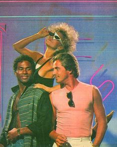 two men and a woman are standing together in front of a neon colored background with the words'80s'written on it