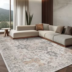 a living room with a large rug on the floor next to a couch and coffee table