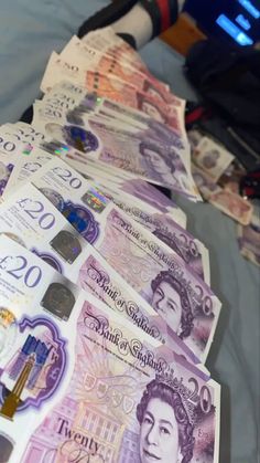 several british pound notes laid out on a table