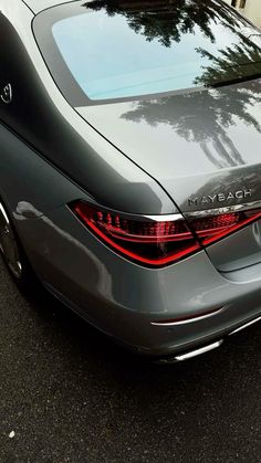 the back end of a car parked in front of a building