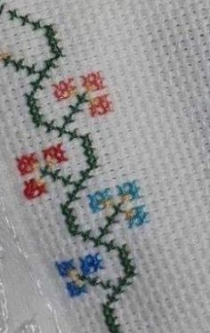 a cross stitch pattern with flowers on it