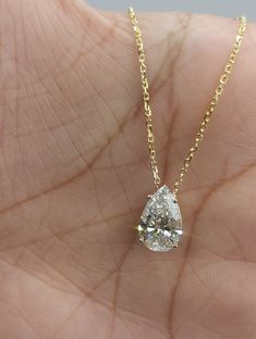 This is a beautiful Lab Grown diamond design pendant. It is set in real solid 14Kt Gold and the chain is 14Kt Gold as well.  You can choose if you want 14Kt White Gold, 14Kt Yellow Gold or 14Kt Rose Gold.  We have a lot of beautiful jewelry with natural diamonds. If any listing states "diamond" then it is a natural diamond. If the listing states "Lab Grown" it is a Lab Grown diamond. The chain is attached at the top so it sits comfortably on you when you wear it. This is the perfect gift for mom Fine Jewelry 14k Gold Pear-shaped Diamond Necklace, 14k Gold Pear-shaped Diamond Necklace, Formal 14k Gold Teardrop Diamond Necklace, Formal Teardrop 14k Gold Diamond Necklace, Gia Certified Yellow Gold Teardrop Jewelry, Pear-shaped Diamond Necklace In 14k Gold, Pear-shaped 14k Gold Diamond Necklace, Gold Pear Shaped Diamond Solitaire Necklace, Gold Pear-shaped Diamond Solitaire Necklace