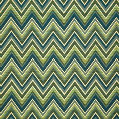 a green and blue area rug with an zigzag pattern