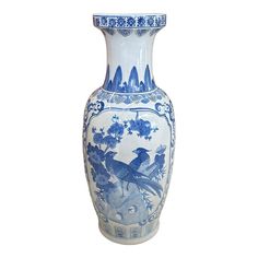 a blue and white vase with birds on it's sides, against a white background