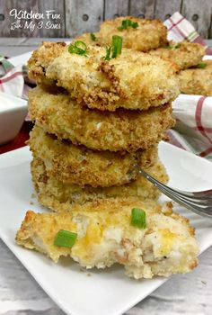 some fried food on a white plate with a fork