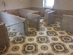 a tiled floor in a bathroom with metal gates