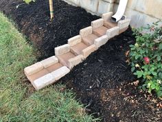 the steps are made out of bricks and mulch