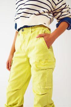 Introducing our Cargo Pants with Tassel Ends in Lime, a stylish and comfortable choice for a casual yet fashionable look. These ankle-length pants are designed to provide a relaxed and effortless fit. With a relaxed fit and straight leg, these cargo pants offer a laid-back style that is perfect for everyday wear. The comfortable fit allows for easy movement, while the straight leg design adds a touch of versatility. Crafted from stretch denim, these pants provide a comfortable and flexible feel. Stretch Denim Fabric, Effortless Outfit, Denim Pocket, Pants Fit, Casual Belt, Modern Trend, Perfect Wardrobe, Estilo Casual, Fast Fashion