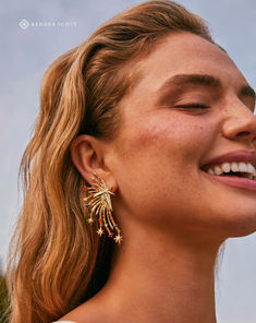 Arced lines dotted with crystal studs and star-shaped embellishments mirror a dramatic firework display, creating a dazzling look you’ll wow in ✨ Firework Display, Gold Statement Earrings, Star Jewelry, Crystal Drop Earrings, White Crystal, Crystal Drop, Brass Material, Strand Necklace, Gold Stars