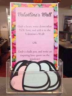 a valentine's wall sign with candy in it