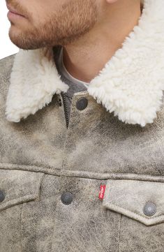 Be cozy, warm and classically cool in this trucker jacket featuring a solid wash and plush faux-shearling lining. 25 1/2" length (size Medium) Front snap closure Spread collar Button cuffs Chest button-flap patch pockets; front welt pockets Lined, with synthetic fill 99% polyester, 1% spandex with 100% polyester faux-shearling trim Machine wash, tumble dry Imported Men's Clothing Casual Shearling Outerwear With Padded Collar, Casual Shearling Outerwear With Faux Fur Lining, Levis Shirt, Levis Jacket, Trucker Jacket, Shearling Jacket, Gray Jacket, Welt Pockets, Welt Pocket