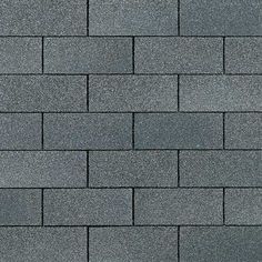 a close up view of a gray brick wall