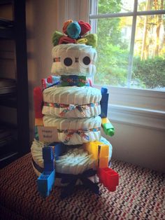 a stack of diapers sitting in front of a window