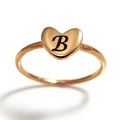 "This rose gold plated initial heart ring is ideal for engraving, it is has a smooth heart shaped surface which is perfect for a single letter. Whether it is your own, or your loved one initial, the stackable initial heart ring is a very unique way to show personalized touch. The rose gold heart ring is elegant and trendy and is great on its own or in a stacked with additional rings. It will be a perfect gift for a birthday, anniversary or any occasion. Customization: * You can order this ring i Personalized Heart-shaped Promise Ring, Personalized Heart-shaped Engraved Promise Ring, Valentine's Day Heart Ring With Initials For Promise, Initials Heart Ring For Valentine's Day Promise, Rose Gold Heart Ring For Promise, Rose Gold Rings With Heart Charm For Valentine's Day, Initials Engraved Heart Ring For Valentine's Day, Personalized Rose Gold Rings For Valentine's Day, Rose Gold Open Heart Ring For Valentine's Day