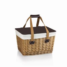 a wicker picnic basket with leather handles