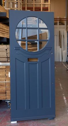 a large blue door sitting inside of a warehouse