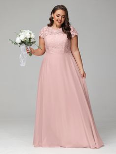 a woman in a long pink dress holding a white bouquet and smiling at the camera