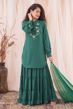 Castleton teal green kurta with satin ribbon, zardozi, pearls and stone floral pattern embroidery. Comes with tiered sharara and tassel edged dupatta. - Aza Fashions Green Ruffled Sets For Diwali, Green Sharara With Ruffles And Traditional Drape, Green Ruffled Sharara With Traditional Drape, Green Semi-stitched Sharara With Dabka Details, Green Ruffled Sharara For Diwali, Green Palazzo Set With Dabka For Eid, Eid Green Sharara With Dabka Work, Green Sharara With Dabka Work For Eid, Green Bollywood Sharara With Ruffles