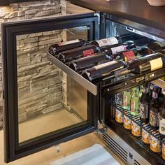 an open refrigerator filled with lots of bottles