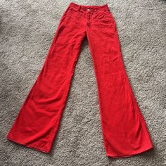 These are in great condition! Super fun bright red corduroy flared jeans. Perfect condition for hemming if they are too long, as the edges are serged and won't have to be undone.  26" waist 10.5" rise 35" inseam B06 Red High-waist Corduroy Bottoms, High Waist Red Corduroy Pants, Red Fitted Corduroy Bottoms, Fitted Red Corduroy Bottoms, Fitted Red Corduroy Pants, Red Corduroy Jeans For Fall, Red Stretch Wide-leg Flare Jeans, Red Stretch Wide-leg Jeans, Fall Red Corduroy Jeans