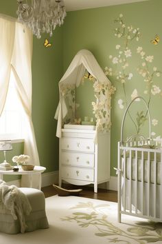 a baby's room with green walls, white furniture and flowers on the wall