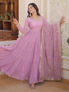 Elevate your style with our stunning pretty light purple sequins georgette function wear gown with dupatta. This gorgeous gown is crafted from light purple georgette material and adorned with intricate embroidered and sequin work, making it the perfect choice for festivals, events, or any special function.
The gown comes fully stitched in sizes ranging from XS to XXL, ensuring a perfect fit for every body type. With a 12-meter flair and a gown length of 56 inches, this gown exudes elegance and g Eid Georgette Sequin Gown, Purple Sequined Dress For Diwali, Purple Sequin Dress For Eid, Purple Georgette Dress With Sequins, Purple Sequined Georgette Dress, Sequin Georgette Anarkali Set Maxi Length, Maxi Length Sequined Anarkali Set In Georgette, Sequined Maxi Length Georgette Anarkali Set, Purple Party Wear Dress With Dupatta